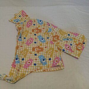 Beautiful short polyester blouse with Calinours prints